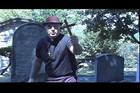 The Date — priest with cross in cemetery
